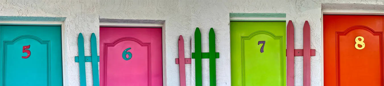 The colorful doors of rooms 5 through 8 at Poco Loco Lodge, Port O'Connor, Texas